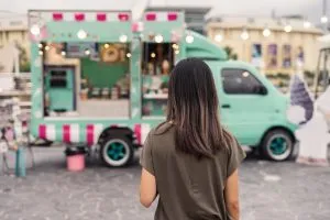 Customer browsing a food truck market